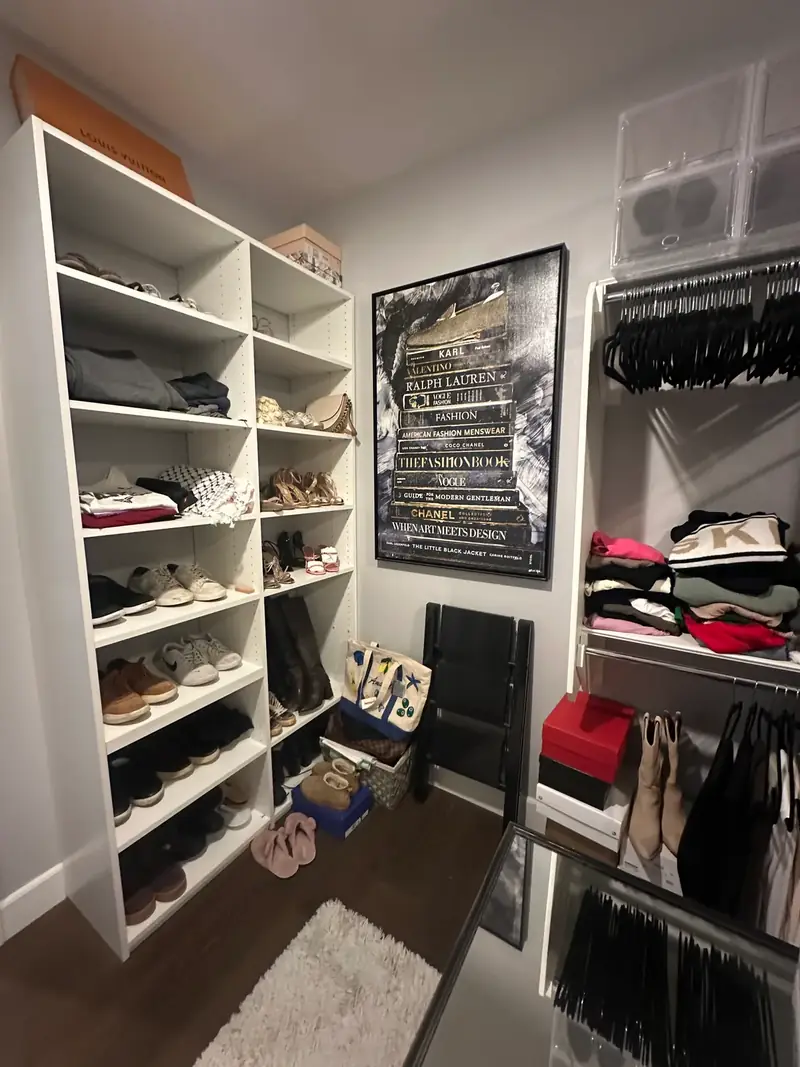 Before: Huntington Beach walk-in closet shelves with mixed shoes, hats and bins, and bags on the floor