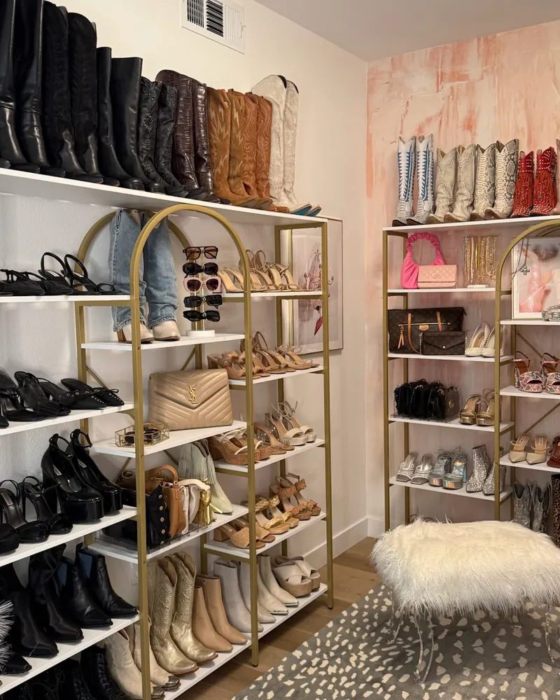 Newly set-up closet with boots, bags, and shoe shelves