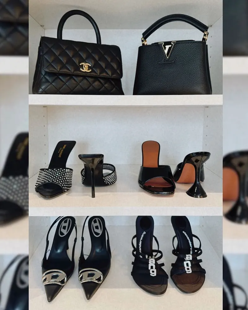 Designer handbags and heels styled on white shelves