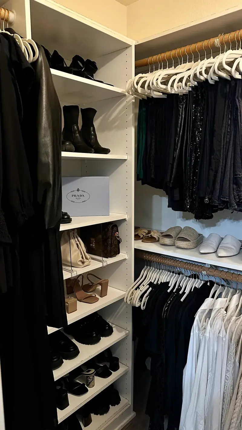 After: Santa Monica closet with boots, bags and shoes on white shelves next to neat rows of hanging clothes