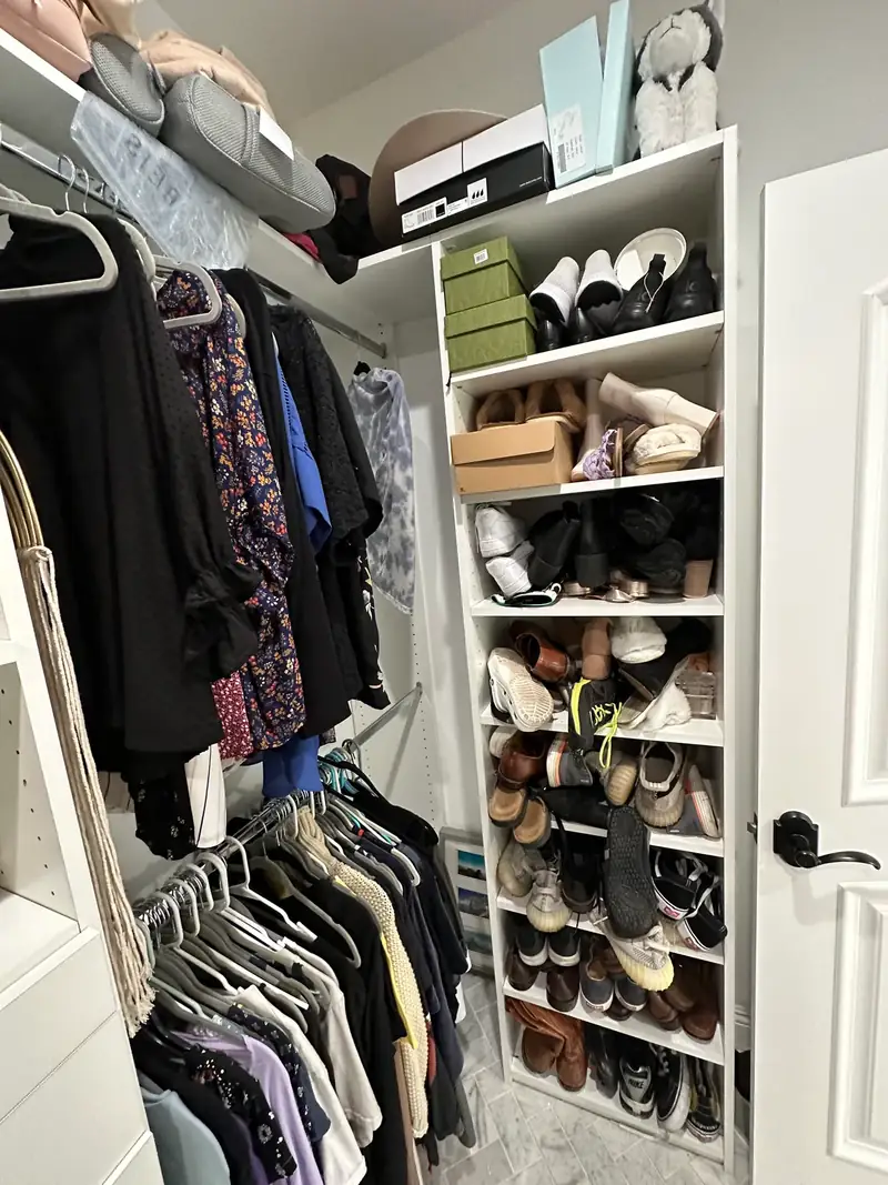 Before: West Hollywood walk-in closet with a tall shoe shelf packed with mixed pairs